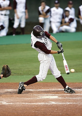 Texas A&M baseball player swinging bat during game