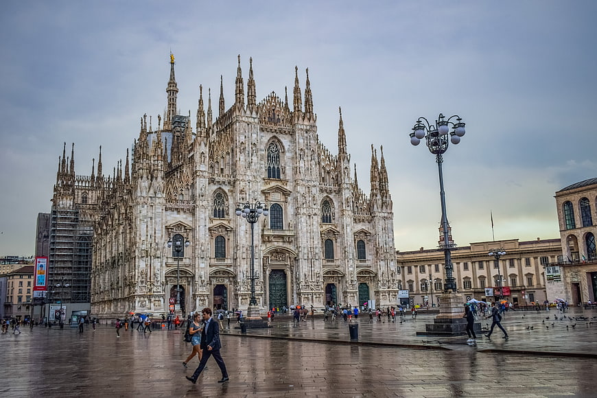 Milan Cathedral Facade in Rainy Weather with Pedestrians in Piazza del Duomo