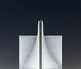 Futuristic white architectural structure against starry night sky