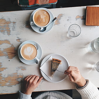 Top view of coffee and cake on rustic table