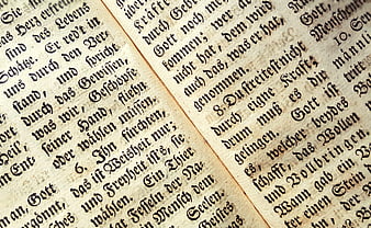 Close-up of antique German hymn book page with Fraktur text