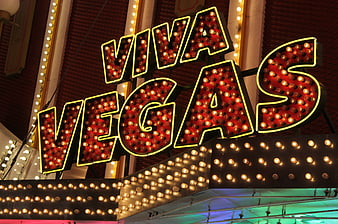 Viva Vegas illuminated marquee sign at night