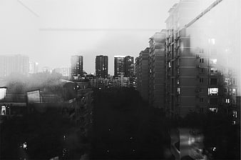 Black and white urban cityscape through window
