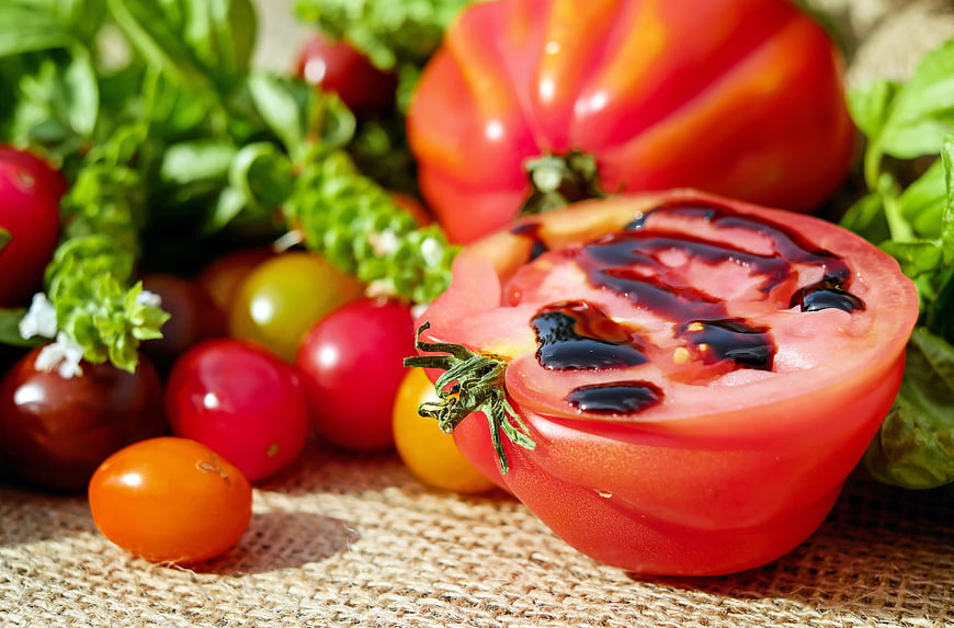 Fresh heirloom tomatoes with balsamic glaze and basil