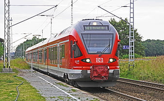 Red DB Regional Express Train on Railway Tracks