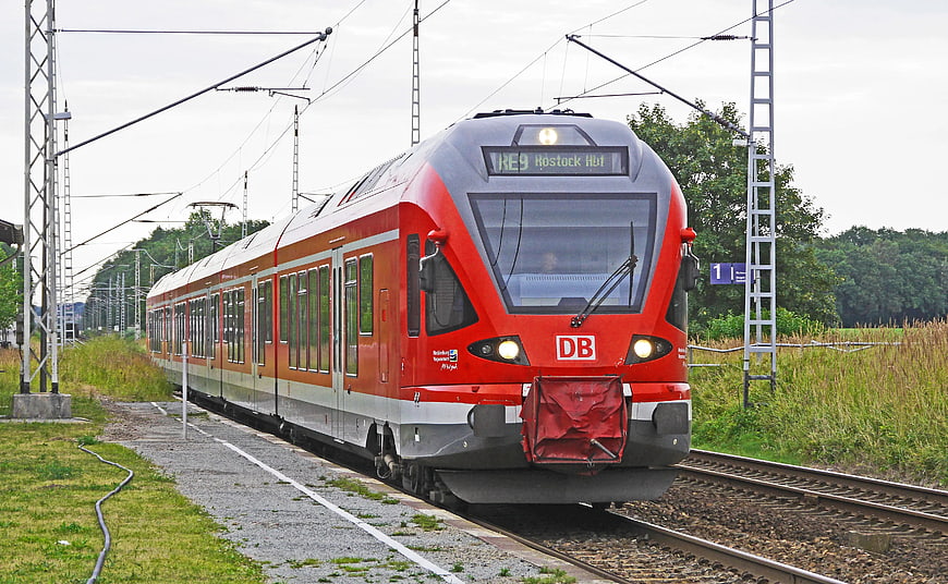 Red DB Regional Express Train on Railway Tracks