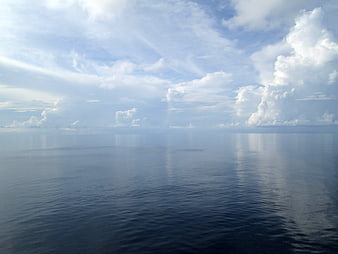 Serene Ocean Horizon with Cloud Reflections