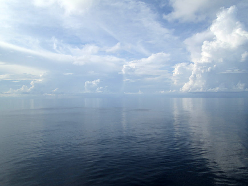 Serene Ocean Horizon with Cloud Reflections