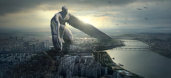 Giant Winged Guardian Angel Statue Overlooking City Skyline