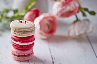 Stack of Colorful Macarons with Pink Flowers