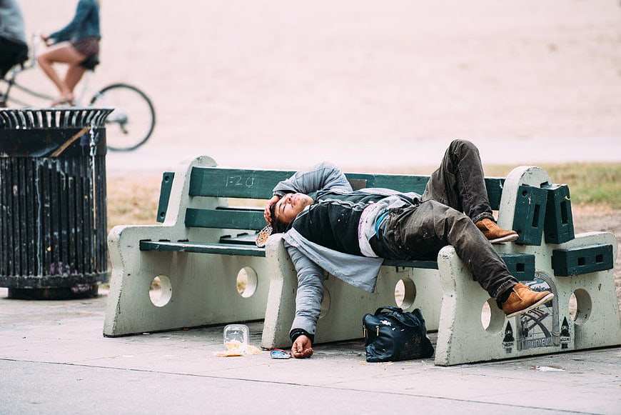 Man Sleeping on Park Bench Homeless