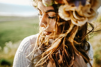 Woman with Flower Crown in Windy Field