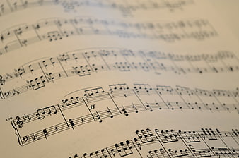 Close-up of classical piano sheet music with musical notes