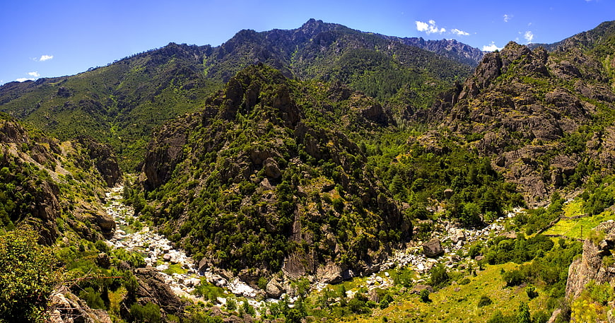 Panoramic View of Rocky Mountain Valley with River in Corsica