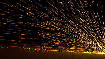 Dynamic Sparks Flying from Grinding Metal at Night
