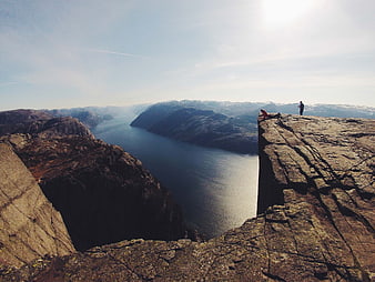Trolltunga Cliff View Over Norwegian Fjord with Hikers