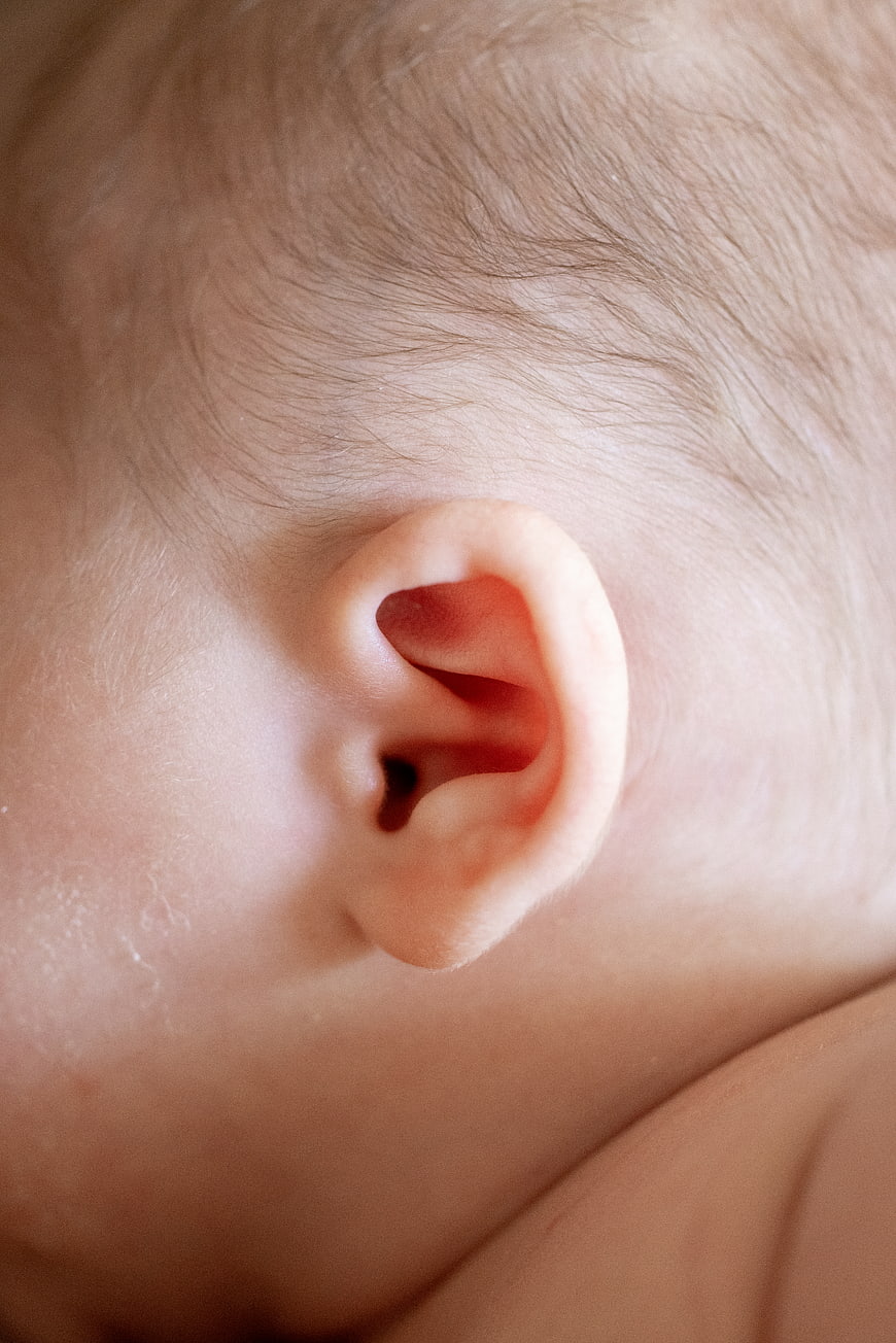 Close-up of a baby's ear and fine hair