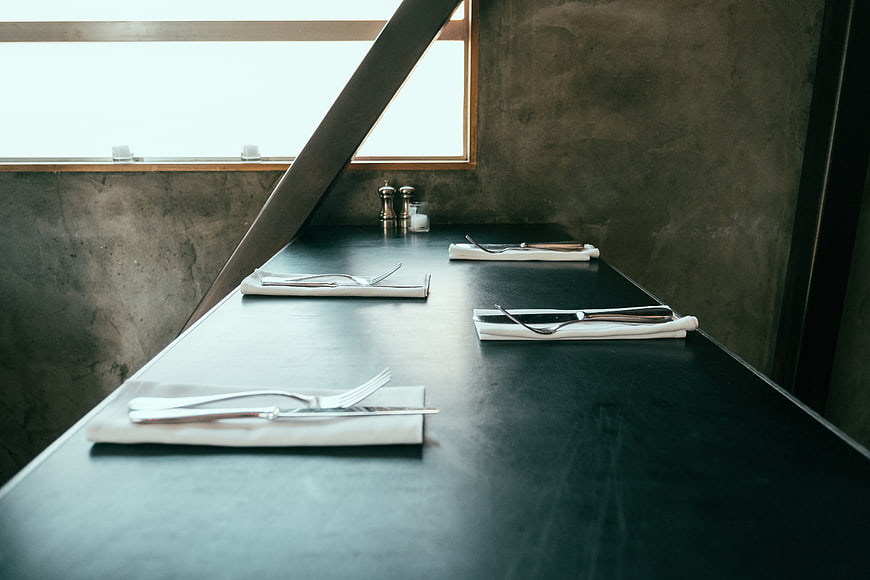 Minimalist Dining Table Setting with Cutlery and Napkins