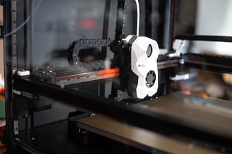 Close-up of 3D Printer Nozzle Printing with Glowing Hotend