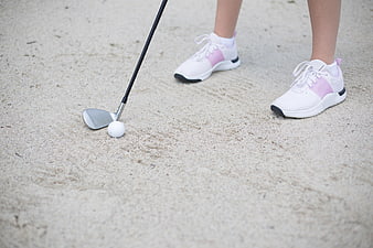 Golfer in Sand Trap with White and Pink Sneakers