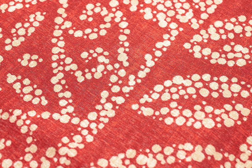Red fabric with white dotted pattern texture background