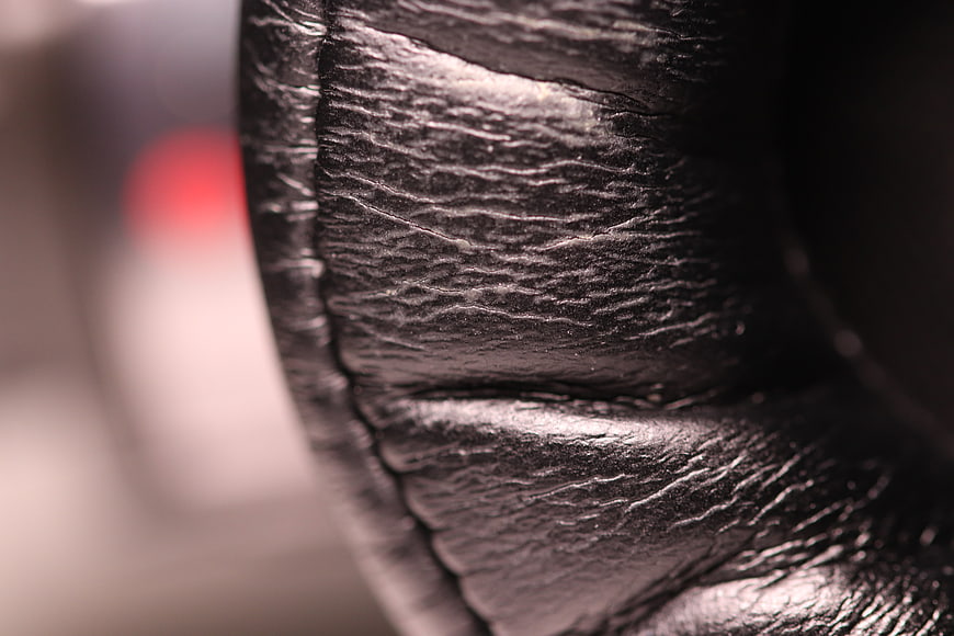 Close-up of black leather headphone ear cup texture