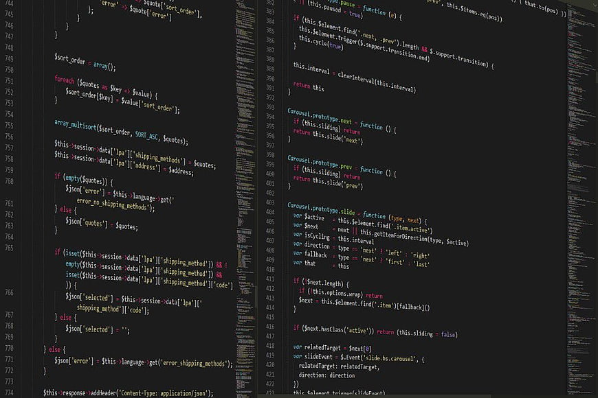 Computer Screen Displaying PHP and JavaScript Programming Code