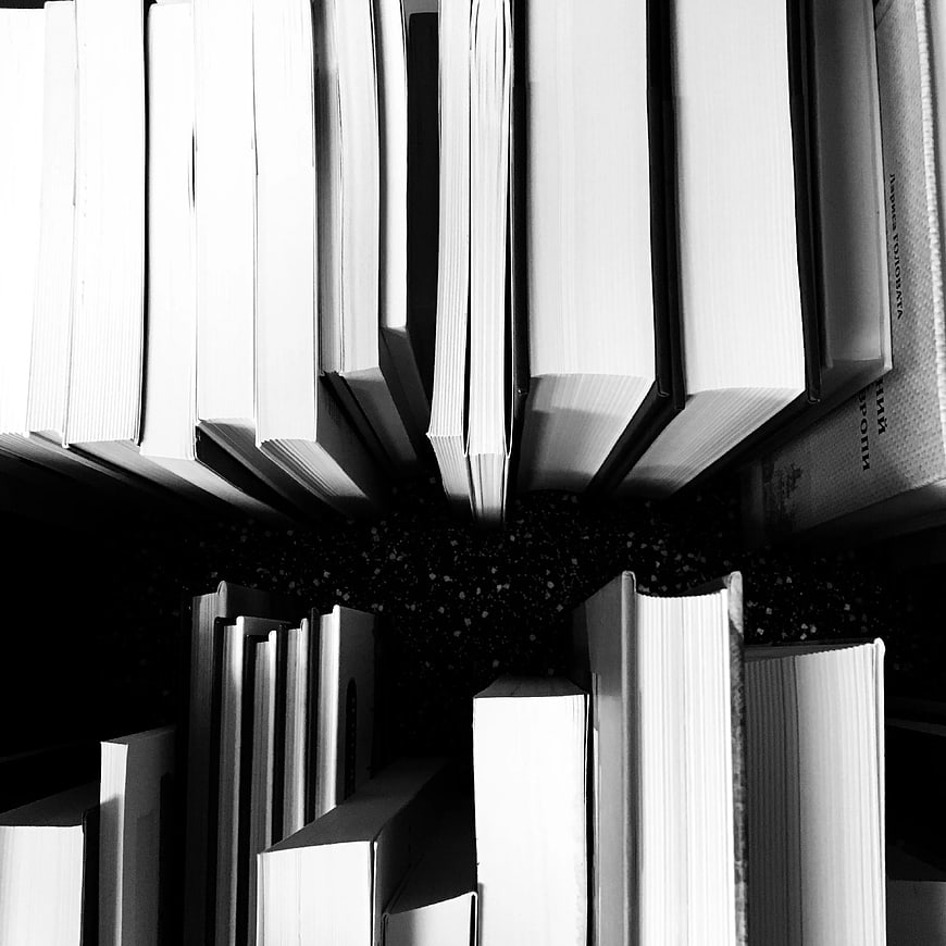 Top-down view of books arranged in a circle pattern