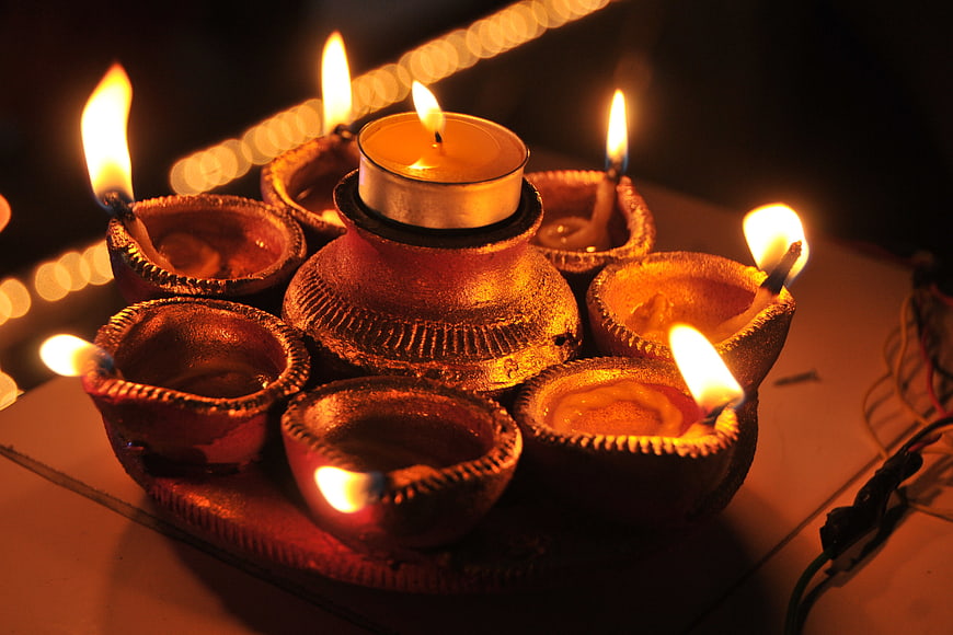 Traditional Indian Diya Lamps with Lit Candles