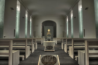 Modern Church Interior with Wooden Pews and Stone Altar