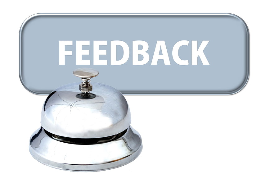 Silver service bell with feedback button on white background