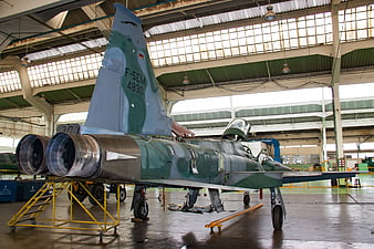 F-5EM fighter jet in maintenance hangar