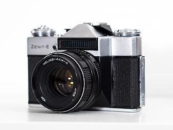 Vintage Zenit-E Film Camera with Helios Lens on White Background