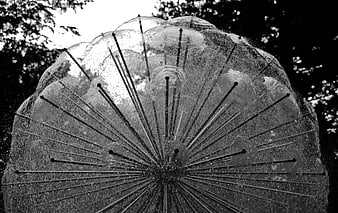 Black and white abstract sculpture with radiating steel spikes