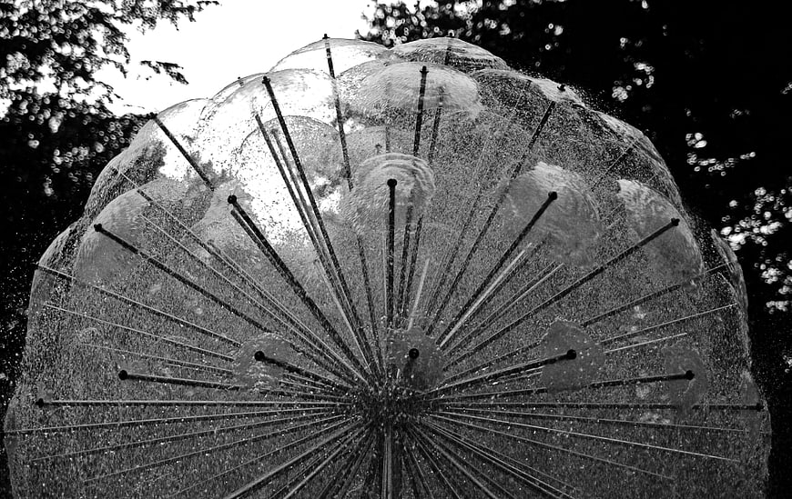 Black and white abstract sculpture with radiating steel spikes