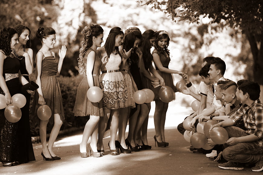 Sepia Toned Group of Students Holding Balloons Outdoors
