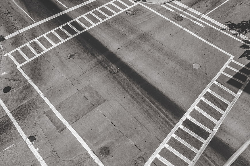 Aerial View of Empty Street Intersection with Crosswalks