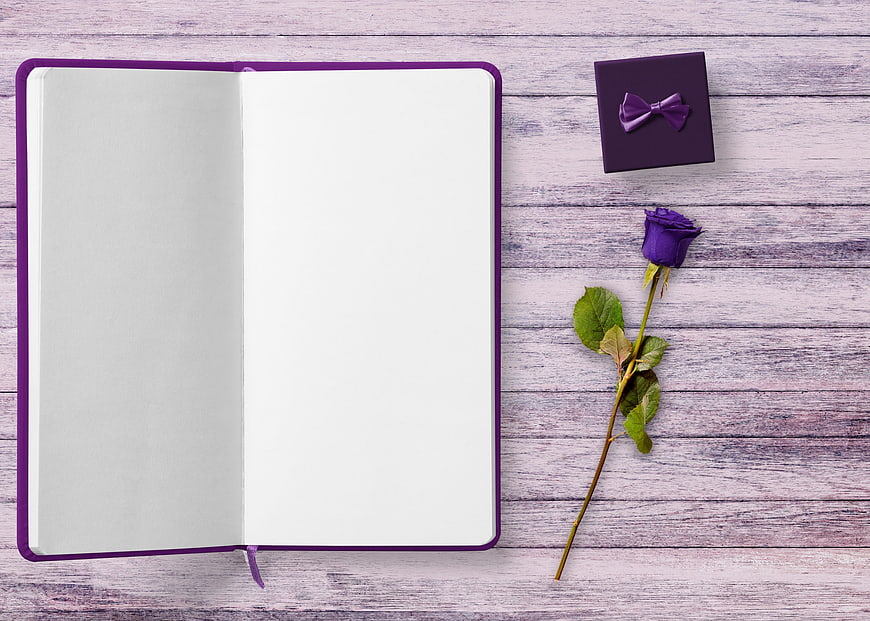 Purple Notebook, Gift Box, and Rose on Wooden Background