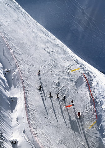 Aerial view of skiers on a snowy mountain slope