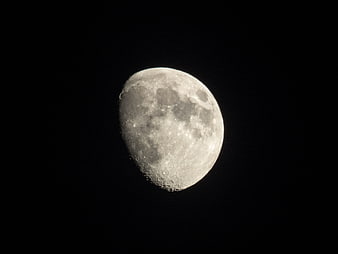 Close-up of a gibbous moon against a black night sky