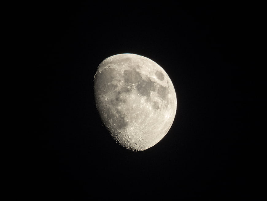 Close-up of a gibbous moon against a black night sky
