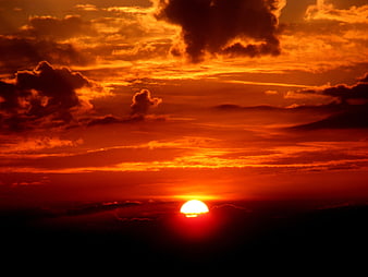 Dramatic Orange Sunset with Dark Clouds