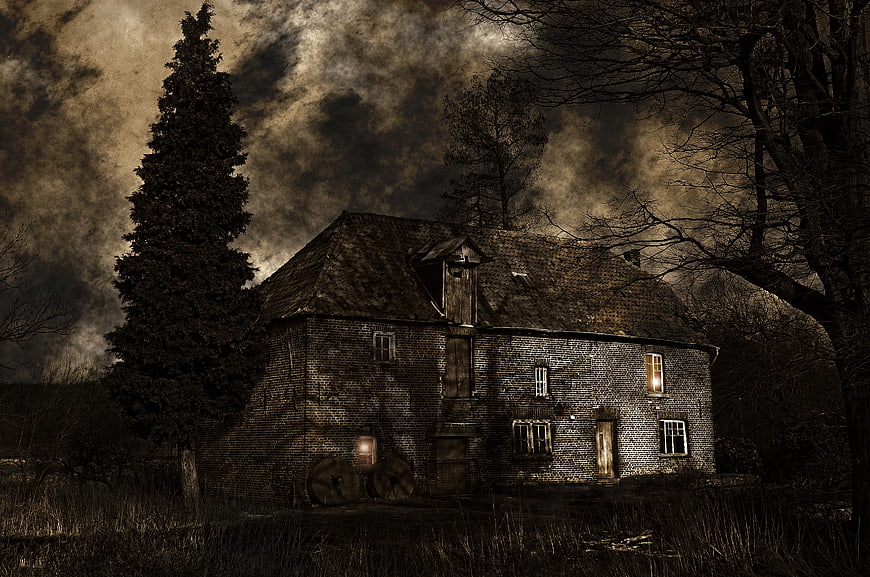 Dilapidated Brick House Under Dramatic Stormy Sky
