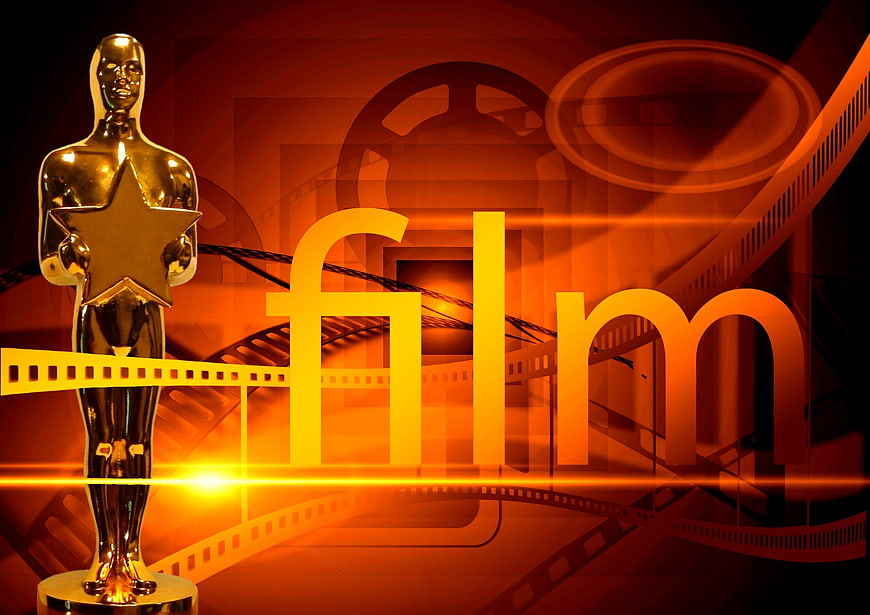 Golden film award trophy with movie reel background