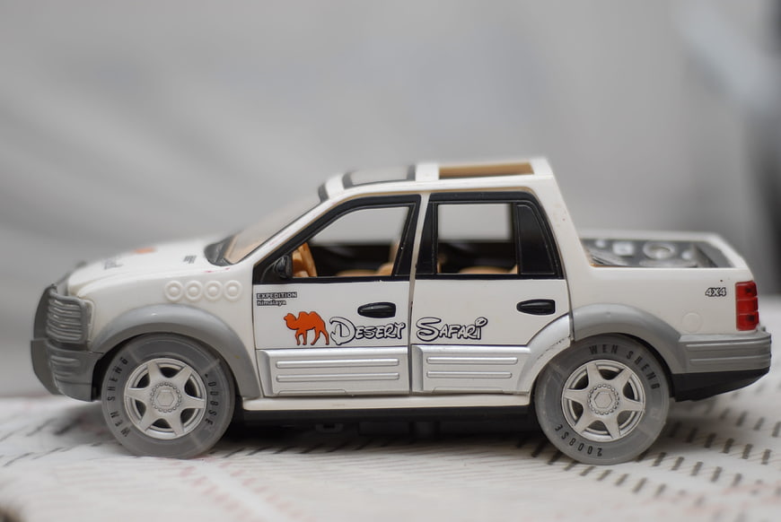 White Toy Pickup Truck with Desert Safari Decal