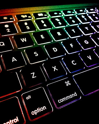 Close-up of Backlit Laptop Keyboard with Rainbow LED Lighting