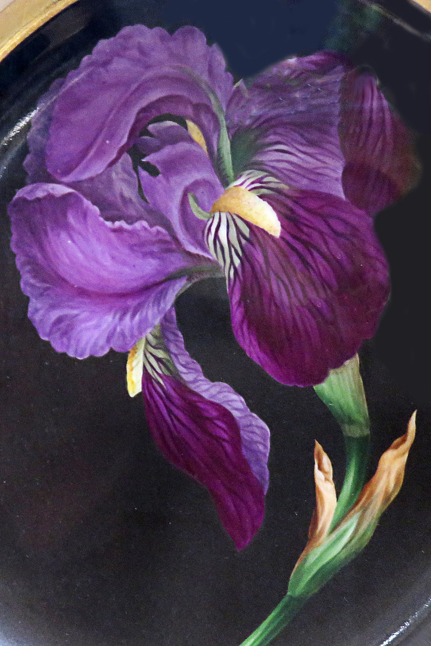 Hand-painted purple iris flower on dark ceramic plate