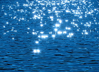 Sparkling Sunlight Reflections on Deep Blue Water Surface