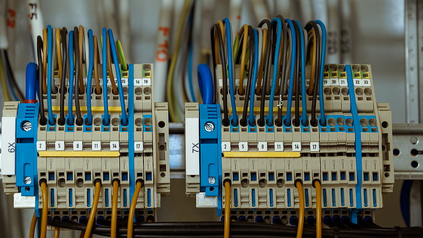 Close-up of industrial electrical terminal blocks with wiring