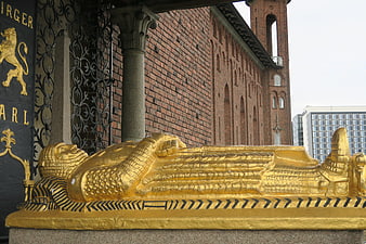 Golden sarcophagus sculpture at Stockholm Cathedral